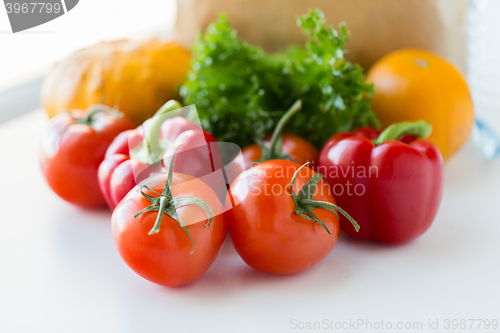 Image of close up of fresh ripe vegetables on kitchen table