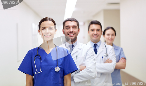 Image of group of happy medics or doctors at hospital