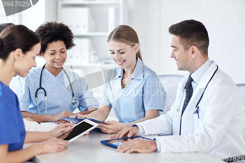 Image of group of happy doctors meeting at hospital office