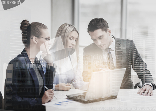 Image of business team with laptop having discussion