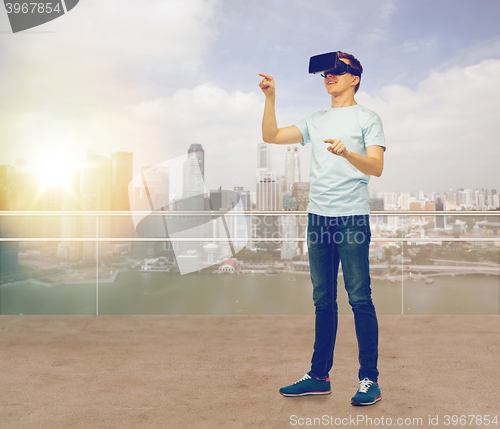 Image of happy man in virtual reality headset or 3d glasses