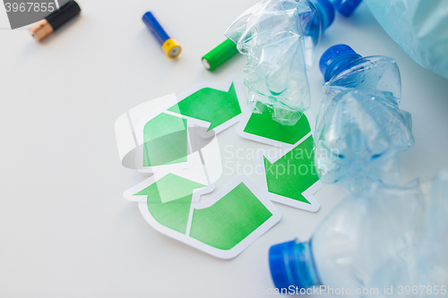 Image of close up of used bottles and batteries recycling