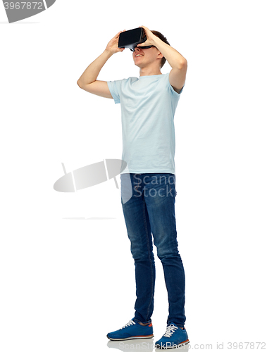 Image of happy man in virtual reality headset or 3d glasses