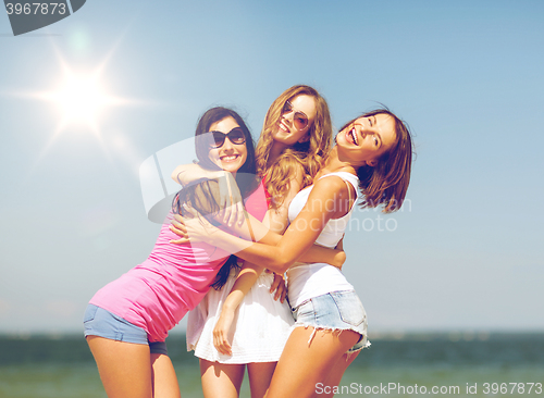 Image of group of girls chilling on the beach