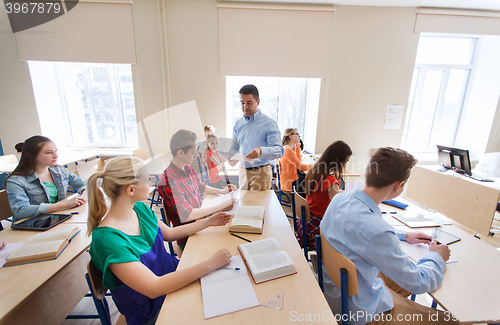 Image of group of students and teacher with test results