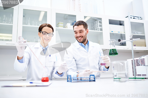 Image of young scientists making test or research in lab