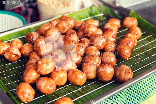 Image of fried meatballs sale at street market