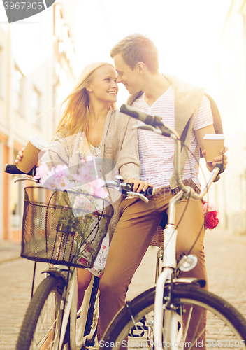 Image of couple with bicycles in the city