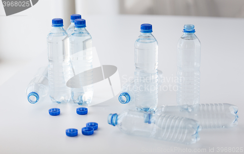 Image of close up of bottles with drinking water on table