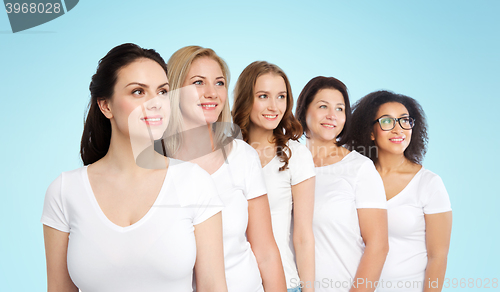 Image of group of happy different women in white t-shirts