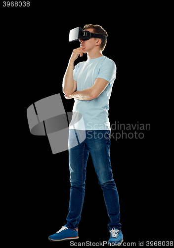 Image of happy man in virtual reality headset or 3d glasses