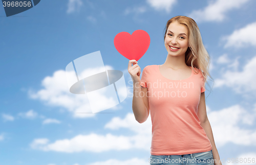 Image of happy woman or teen girl with red heart shape