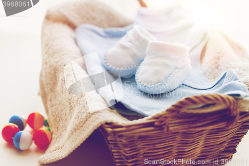 Image of close up of baby clothes for newborn boy in basket