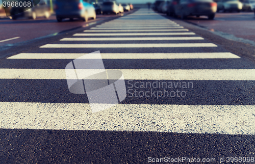 Image of close up of pedestrian crosswalk on city parking