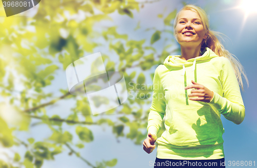 Image of woman jogging outdoors