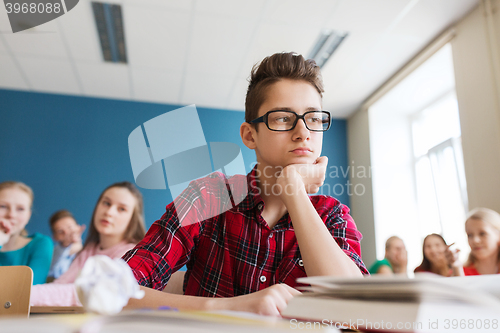 Image of students gossiping behind classmate back at school