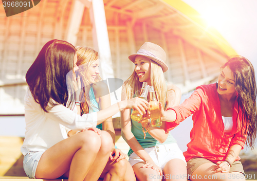 Image of girls with drinks on the beach