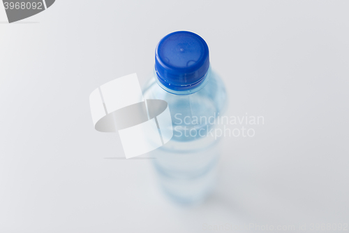 Image of close up of bottle with drinking water on table