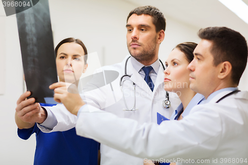 Image of group of medics with spine x-ray scan at hospital