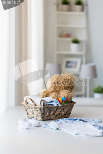 Image of close up of baby clothes and toys for newborn