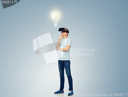 Image of happy man in virtual reality headset or 3d glasses