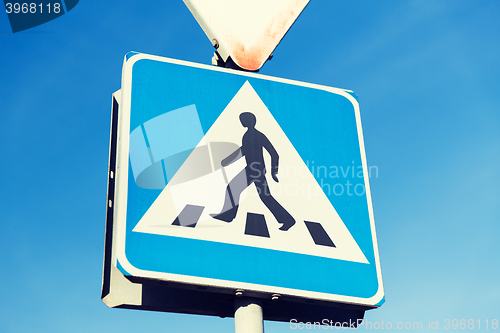 Image of close up of pedestrian crosswalk road sign