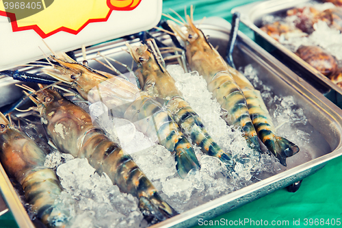 Image of shrimps or seafood on ice at asian street market
