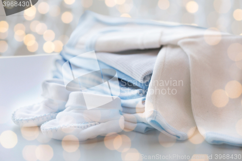 Image of close up of baby boys clothes for newborn on table