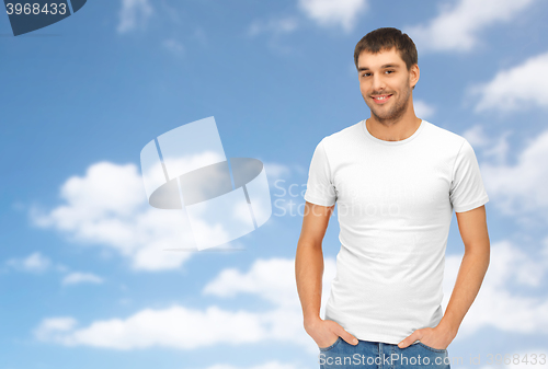 Image of happy man in blank white t-shirt
