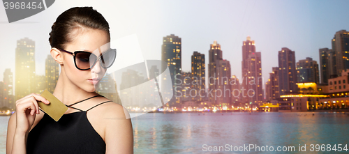 Image of beautiful young woman in elegant black sunglasses