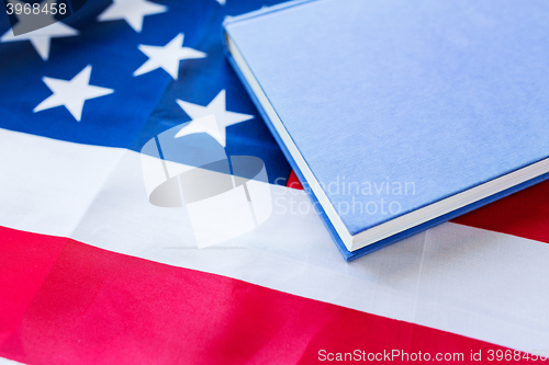 Image of close up of american flag and book