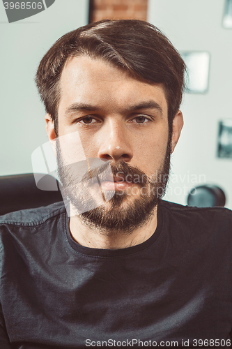 Image of The young man looking at camera