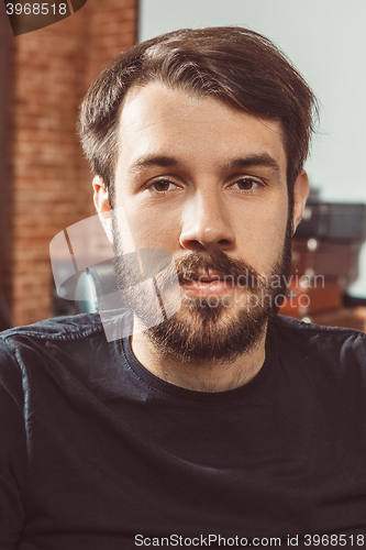 Image of The young man looking at camera