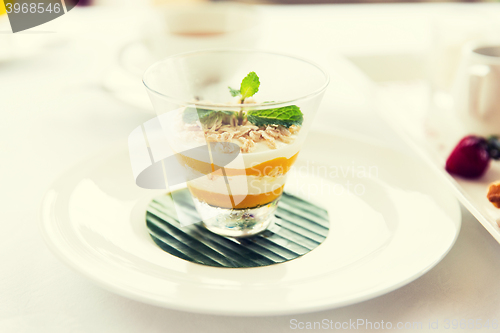 Image of close up of dessert in glass at restaurant