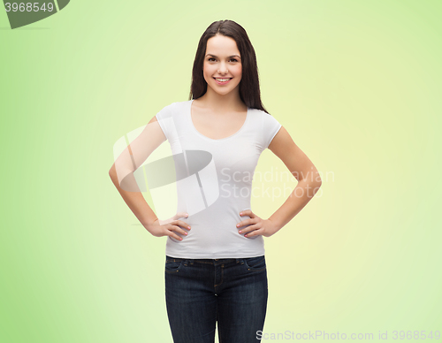 Image of smiling young woman in blank white t-shirt