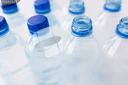 Image of close up of bottles with drinking water on table