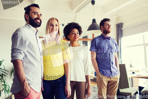 Image of happy creative team in office