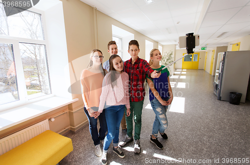 Image of group of students taking selfie with smartphone