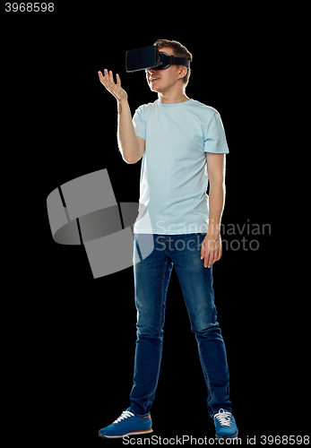 Image of happy man in virtual reality headset or 3d glasses