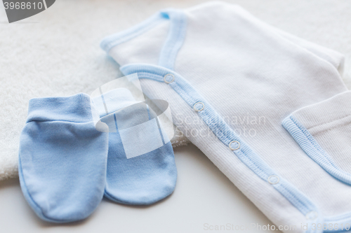 Image of close up of baby boys clothes for newborn on table