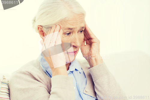 Image of face of senior woman suffering from headache