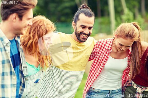 Image of group of smiling friends outdoors