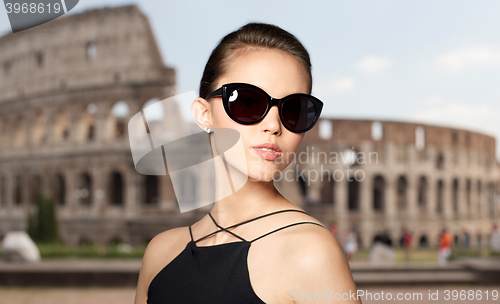 Image of beautiful young woman in elegant black sunglasses