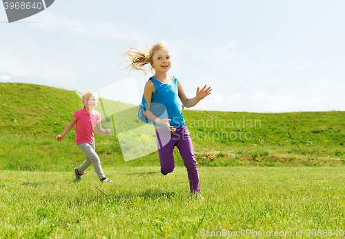 Image of group of happy kids running outdoors