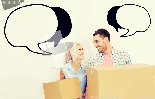 Image of couple with delivery boxes moving to new home