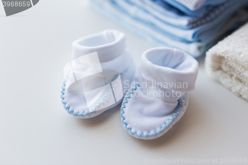 Image of close up of baby boys clothes for newborn on table