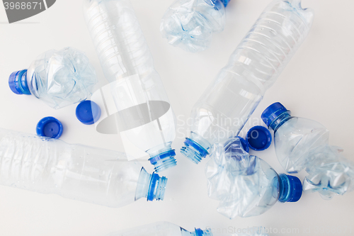 Image of close up of empty used plastic bottles on table