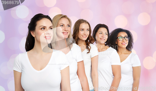 Image of group of happy different women in white t-shirts