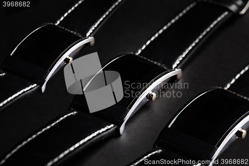 Image of close up of black smart watch or wristwatch set