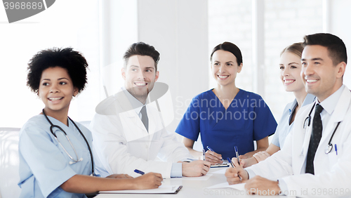 Image of group of happy doctors meeting at hospital office